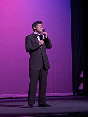 Junior Anthony Dalilis performs, “Start a Fire” for the Musical Moments show.