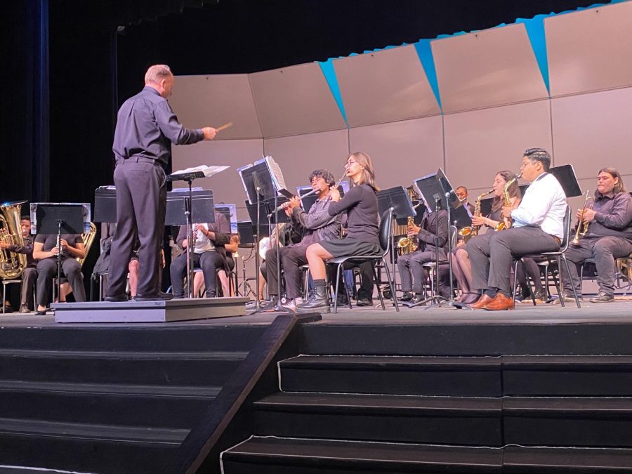 Mr. Gray conducts the students through the final band concert together as a family.