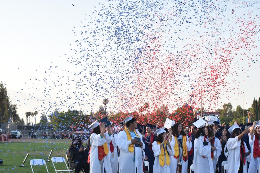 After+the+graduated+Class+of+2022+turn+their+tassels+from+right+to+left%2C+they+are+filled+with+emotions+as+they+are+rained+on+with+colored+confetti+of+red+and+blue.