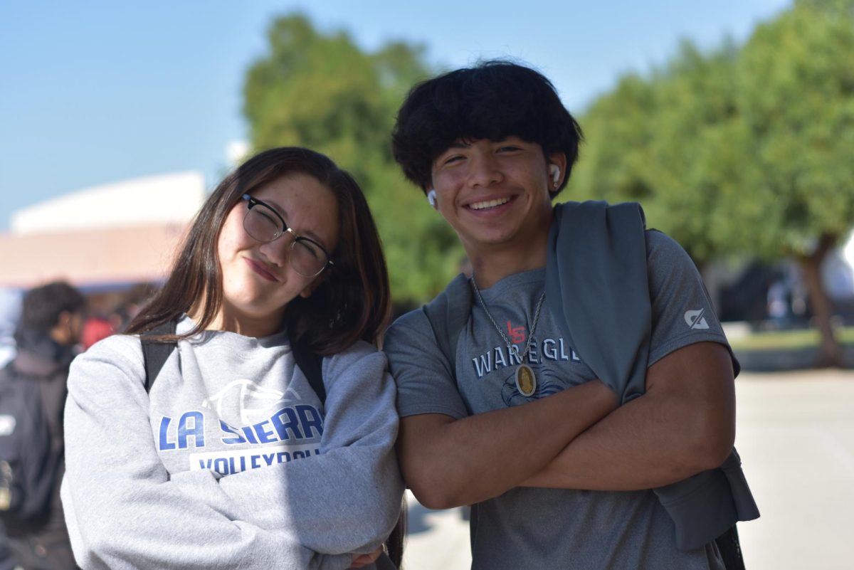 Eunice Castro (11) and Juan Sanchez (12) hanging out and walking during passing period together.