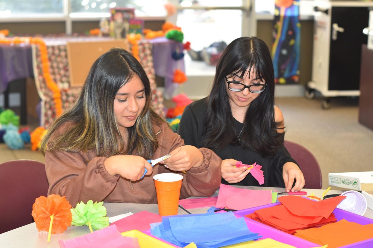 Angelina Marquez (12) and Ann Fuentes (12) construct paper cempasuchil for the altar. After seeing the grand altar constructed by our students, many sit back to celebrate their pride for their heritage celebrating Dia de los Muertos.
11/2/23  Written and photographed by Cody Delgado