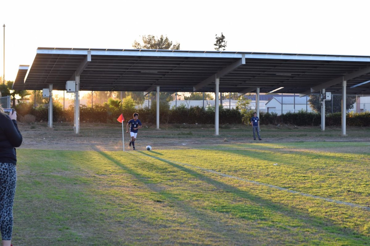Boys Varsity Soccer team player, Eric Palacios (11), is getting ready to attempt a goal kick.

12/7/23  Written and photographed by Yaquelyn Gomez