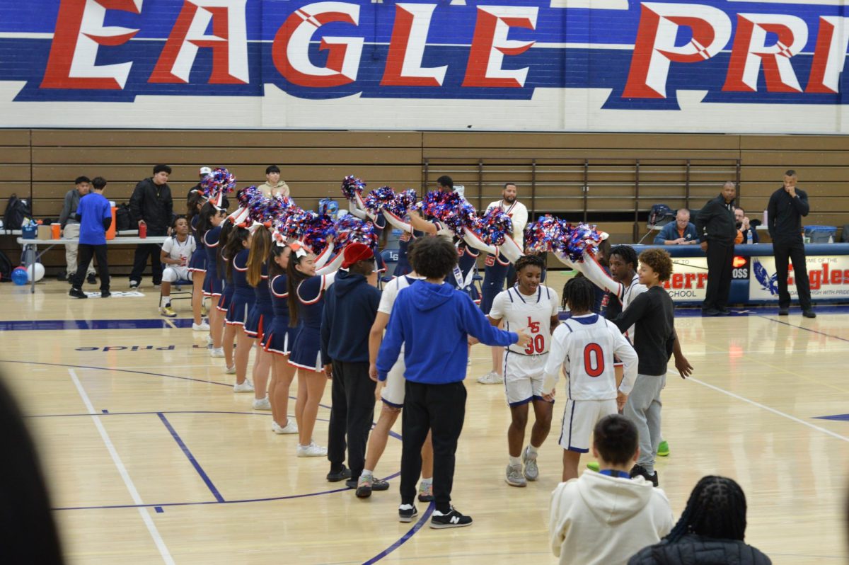 Cheerleaders gather into their positions to celebrate the boys basketball seniors. Despite their loss to Hillcrest, boys basketball, dance and cheer enjoyed their senior night.

1/30/24  Written and photographed by Marilyn Palacios