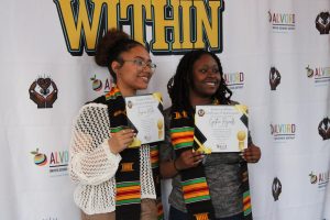La Sierra High School seniors Jasmine Miller and Cynthia Reynolds pose with their certificates and gifted stoles.